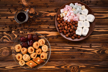 Coffee with rahat  and dried fruits on a wooden table
