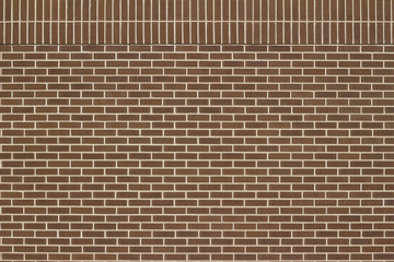 Vintage brown color brick wall background in traditional running bond pattern with double header rows