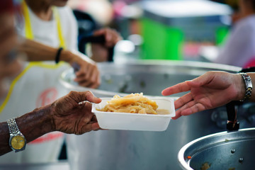 People who are rich and mentally assisting people in society, sharing food for the hungry : Help and Donation Concepts