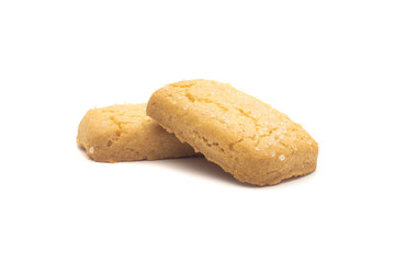 one side of two butter cookies on white background