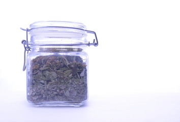 isolated transparent jar of deciduous tea on a white background