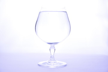 crystal transparent glass for cognac on a white background