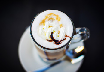 Creamy latte with chocolate close up
