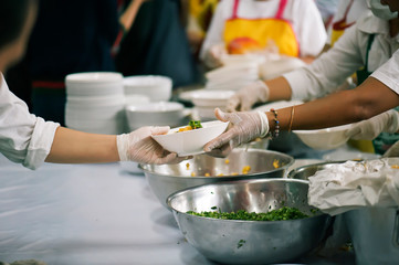 Volunteers Share Food to the Poor to Relieve Hunger: Charity concept