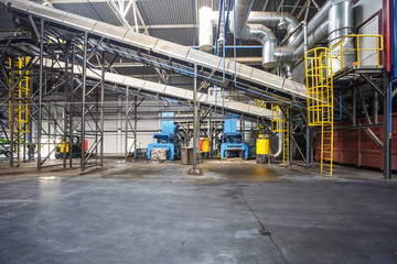 Fototapeta premium moving conveyor transporter on Modern waste recycling processing plant. Separate and sorting garbage collection. Recycling and storage of waste for further disposal.