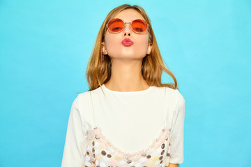 Young beautiful woman looking at camera.Trendy girl in casual summer clothes in sunglasses....