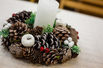Christmas eve, decorated advent wreath with a candle, isolated