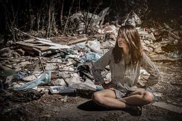 Asian woman to be left alone at A place for waste disposal,sad woman concept