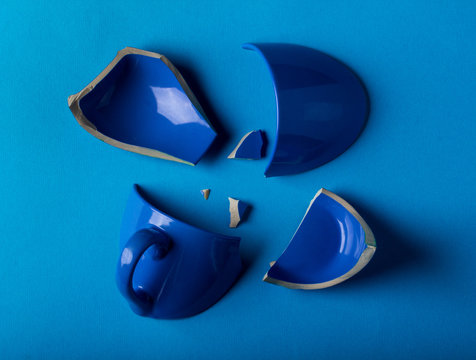 broken blue mug cup background.
