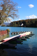 Jetty with old house across water at Lake Walchensee in Bavaria-Germany in autumn 3575