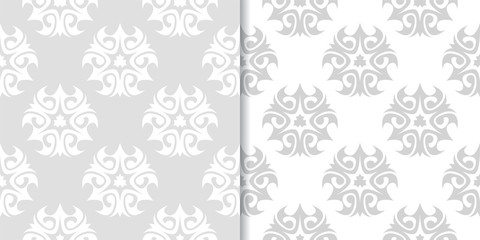 Light gray floral backgrounds. Set of seamless patterns