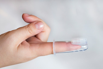 Silicone brush for brushing babies' teeth, put on mother's finger