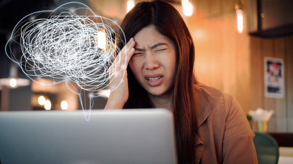 Asian businesswoman in casual suit working head in hand action with stress emotion and Polygonal...