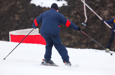 Fototapeta na wymiar A guy skiing from a mountain in winter