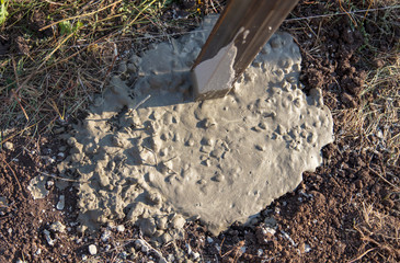 Concrete in the ground for the fence