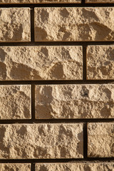 Wall from decorative yellow brick as a background