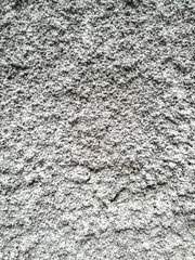 Gray plaster coat on the wall as a background
