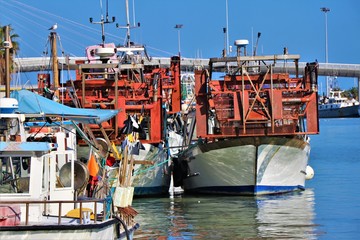 Fishing boats anchored in the harbor.