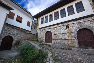 Fototapeta na wymiar Old town Berat, historic city in the south of Albania.Tiny stone streets with white stone houses built in ottoman style. also called city of a thousand windows. World Heritage Site by UNESCO