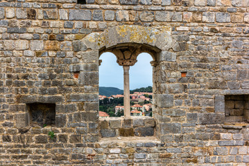 Panorama on the Tuscan hills from an old medieval windown in the walls of Campiglia Marittima in Tuscany - 1