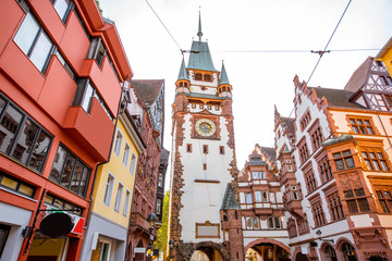 City gate with clock tower in Freiburg city, Germany