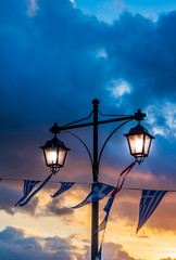 National Greek flag on beautiful sunset clouds