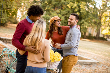 Fototapeta premium Multiracial young people walking in the autumn park