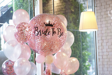 Pink balloons. Helium balloons in pink and white decoration for the hen party with the words...