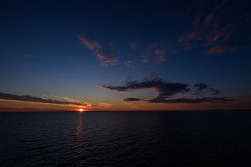 Obraz premium colorful dramatic sunrise in the sea. view from ferry