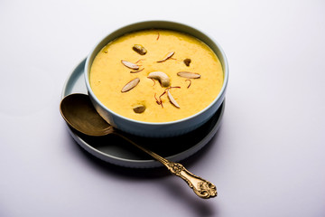 Kaddu or Pumpkin Kheer Or Bhoplyachi Kheer in Marathi and gummadikaya payasam in Telugu, Garnished with dry fruits. served in a bowl over moody background. Selective focus