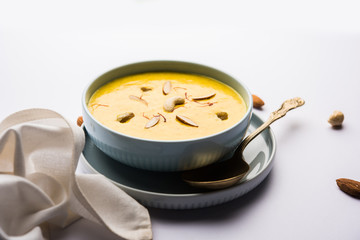 Kaddu or Pumpkin Kheer Or Bhoplyachi Kheer in Marathi and gummadikaya payasam in Telugu, Garnished with dry fruits. served in a bowl over moody background. Selective focus