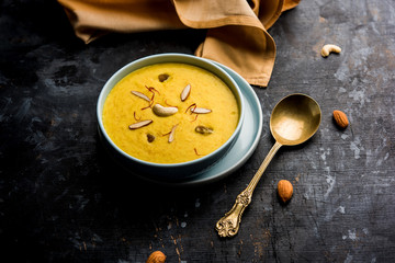 Kaddu or Pumpkin Kheer Or Bhoplyachi Kheer in Marathi and gummadikaya payasam in Telugu, Garnished with dry fruits. served in a bowl over moody background. Selective focus