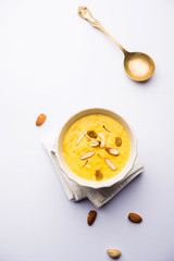 Kaddu or Pumpkin Kheer Or Bhoplyachi Kheer in Marathi and gummadikaya payasam in Telugu, Garnished with dry fruits. served in a bowl over moody background. Selective focus