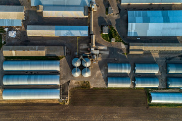 Arched hangars, a large storage for agricultural products. View from above