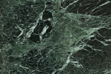The dark green marble. Facing stone. Texture