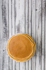 Homemade crepes with frozen berries, topped sugar