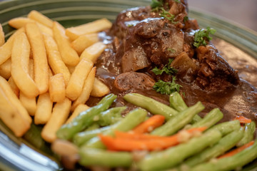 Stewed beef steak with selected focus