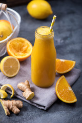 Fresh citrus juice, orange and lemon juice, healthy vitamin drink with ginger