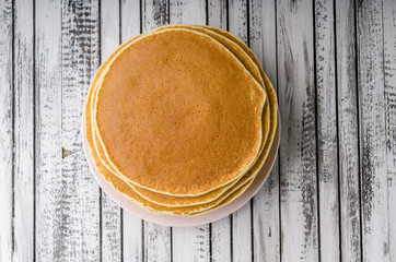Homemade crepes with frozen berries, topped sugar © Stepanek Photography