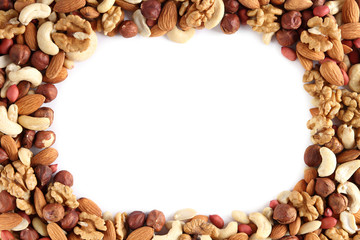 heap of mixed nuts laid out in a circle isolated on white background