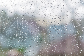 Rain drops on a window glass. Abstract background texture.