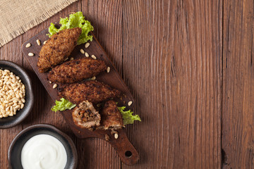 Traditional arabic kibbeh with lamb and pine nuts.