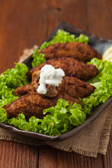 Traditional arabic kibbeh with lamb and pine nuts.