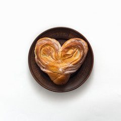 Sweet bun on white background, tiop view, flat lay