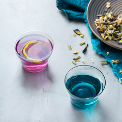 Blue butterfly pea flowers tea in a glass on table
