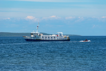 ISLAND ANZERSKY, RUSSIA - JUNE 26, 2018: Tourists land on the island of Anzersky from the ship on an inflatable boat. Arkhangelsk region, White Sea