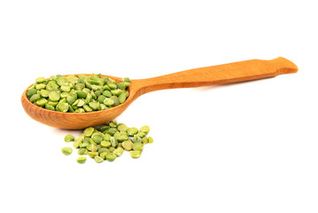 Dry green peas in spoon