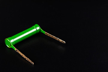 Radio element, very building resistance resistor close-up, on a dark background.