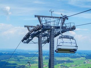Chairlift pier with pulleys over the town Nesselwang
