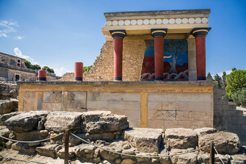 Red columns of the Knossos palace. Fragment of the ruins of the Knossos palace. Architecture on Crete, Greece.